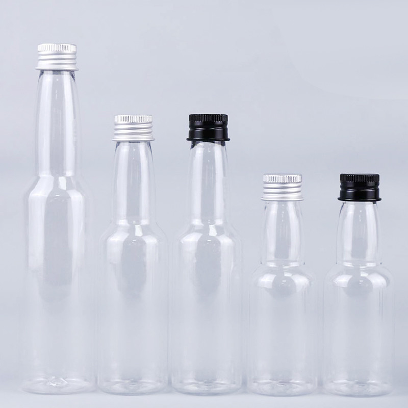 핫 판매 50ml 투명한 둥근 플라스틱 PET 알루미늄 캡과 함께 술 병